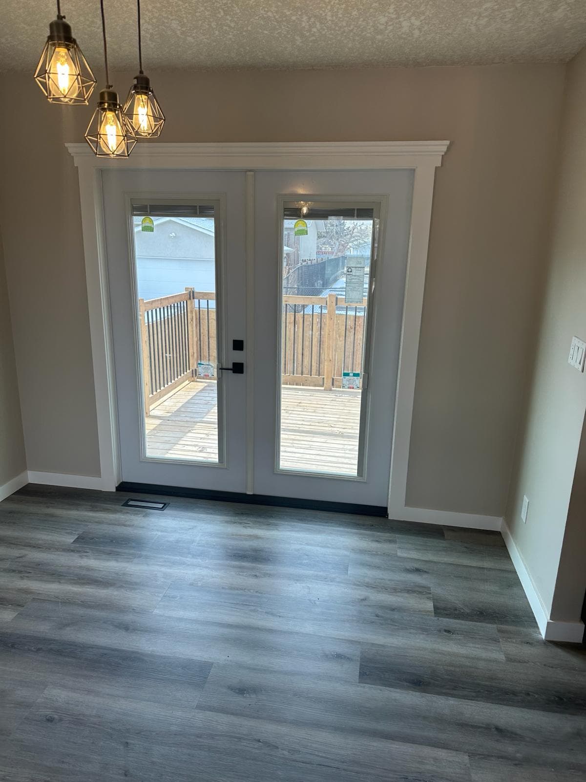 Dining nook with French doors — JFK Surfaces project in Central Alberta