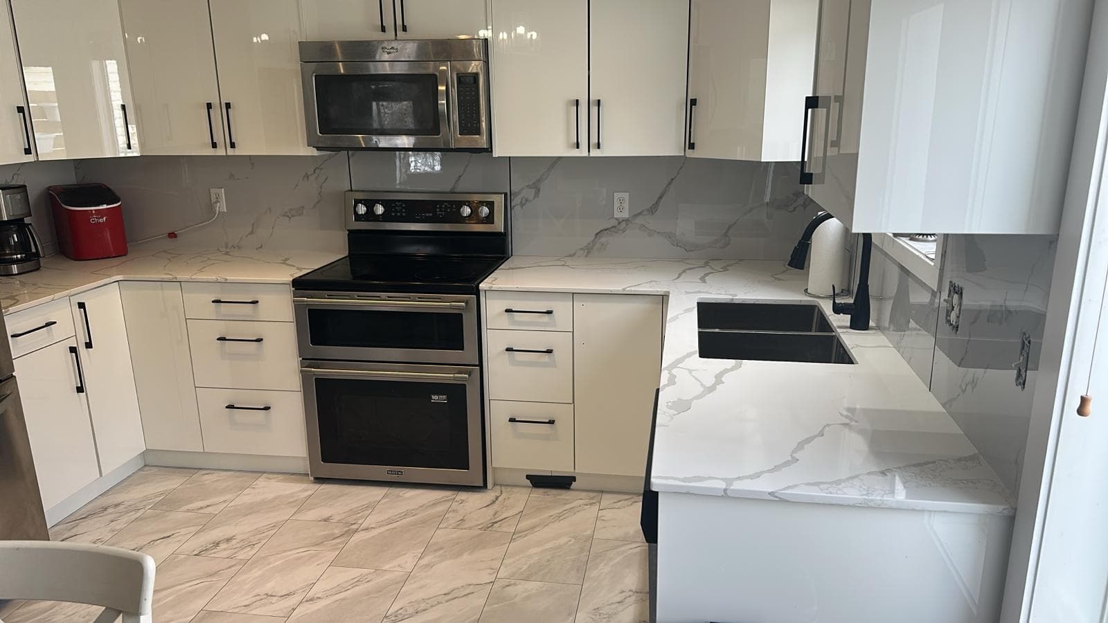 White high-gloss luxury kitchen — JFK Surfaces project in Central Alberta