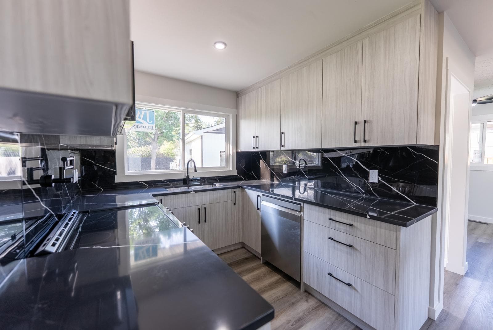 U-shape kitchen with sink view — JFK Surfaces project in Central Alberta