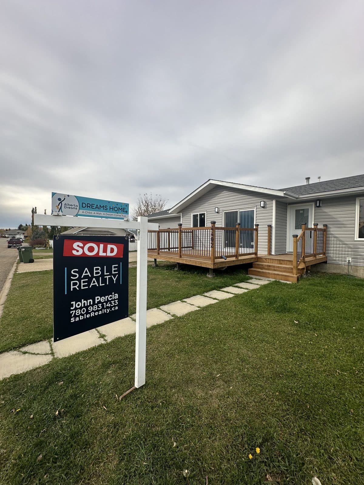 Central Alberta home with sold sign — the result of strategic renovation or as-is sale
