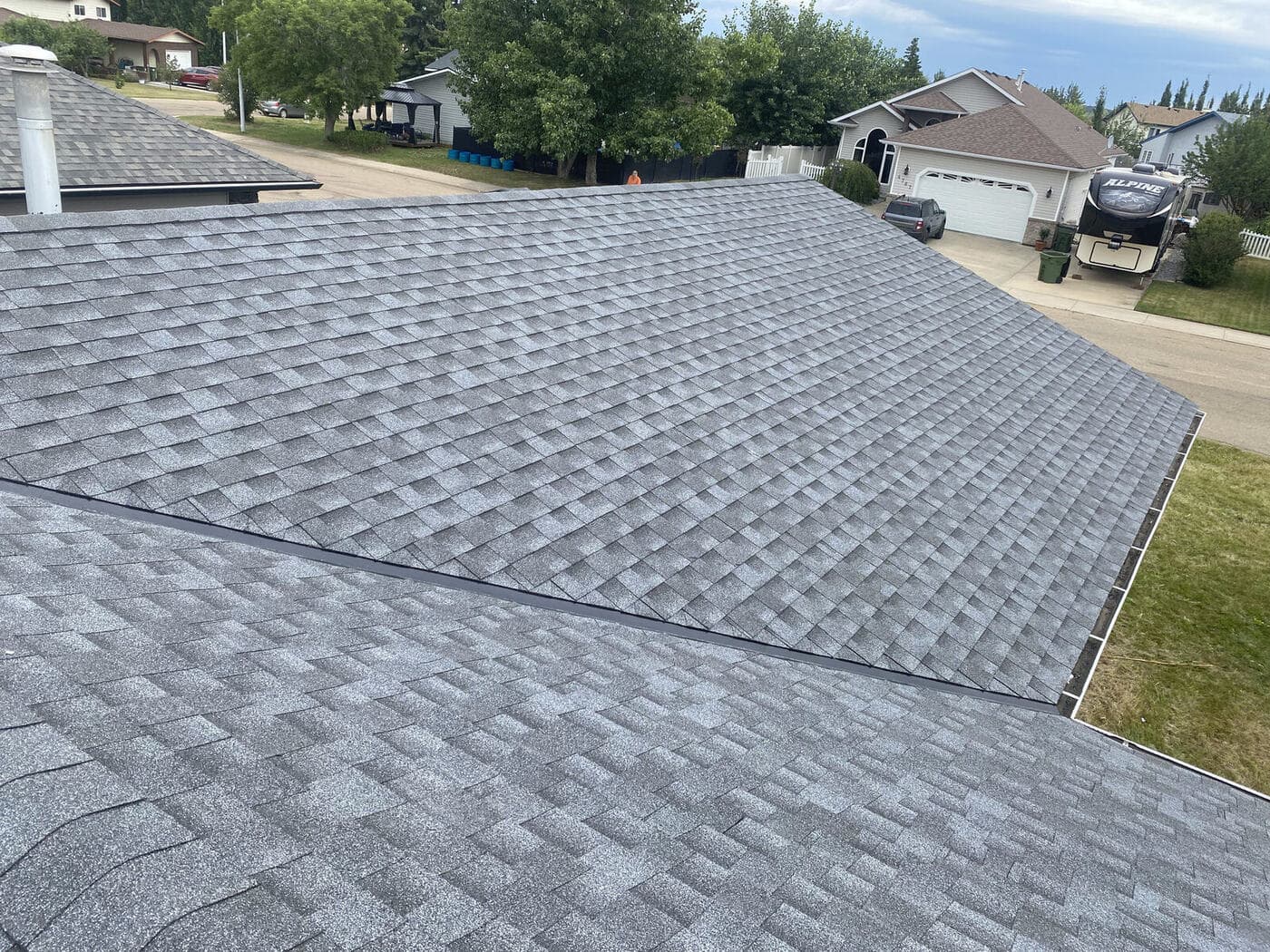 Full asphalt shingle re-roof — JFK Surfaces project in Central Alberta